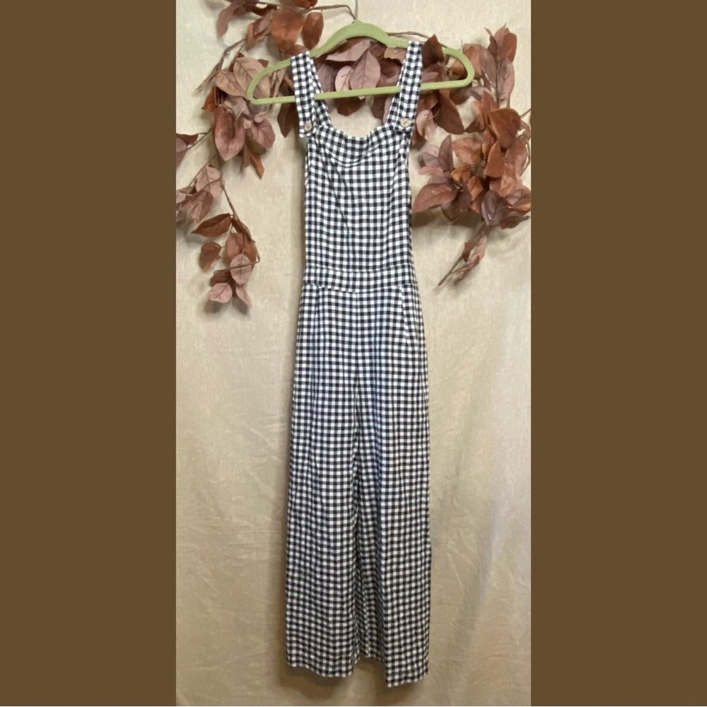 Vonda black and white plaid jumpsuit with wood buttons and button accents.